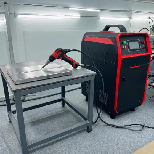 Handheld laser welding machine on steel table